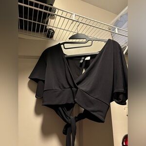 Black top with an open back.